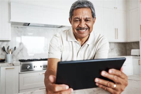 Mature Man Tablet And Home On Social Media Internet And Reading