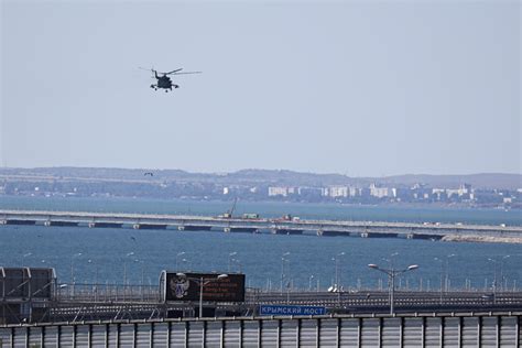 Key Russian Bridge To Crimea Is Struck Again As Putin Vows Response To Attack That Killed 2