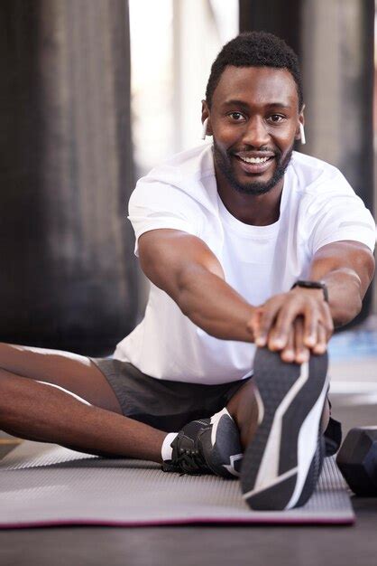 Premium Photo | Fitness stretching and portrait of black man in gym for ...