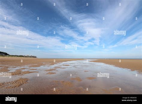 A View Of Old Hunstanton Beach With Blue Skies On A Sunny Day Stock