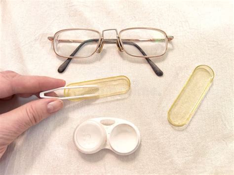 A Set For Contact Lenses With A Container Forceps Glasses The