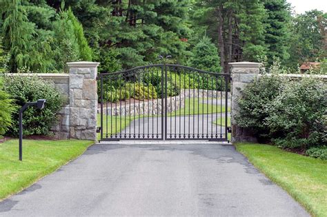 Iron Driveway Gate For A Small Driveway With A Simple Scroll Detail In