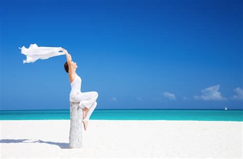 Premium Photo Happy Woman With White Sarong On The Beach