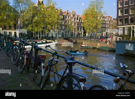 Houses And Bridge Along The Canal Belt Amsterdam Netherlands Stock