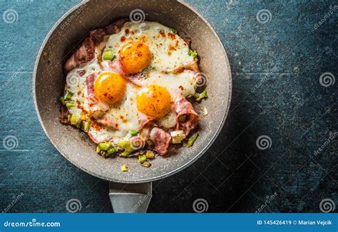 English Breakfast Fried Bacon Ham And Eggs In Ceramic Pan Stock Image