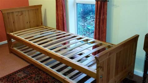 Pine single bed with pull-out bed underneath | in Chislehurst, London | Gumtree