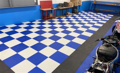 A Blue And White Checkered Floor In A Garage