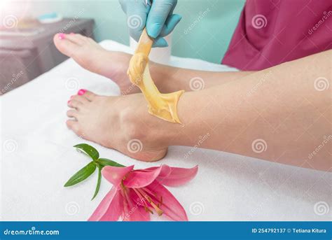 Leg Sugaring A Beautician Makes A Sugar Paste Depilation Of A Woman S