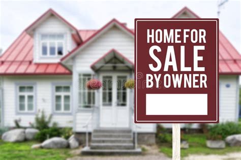 A House For Sale By Owner Or Fsbo Sign In Front Of A Large Story