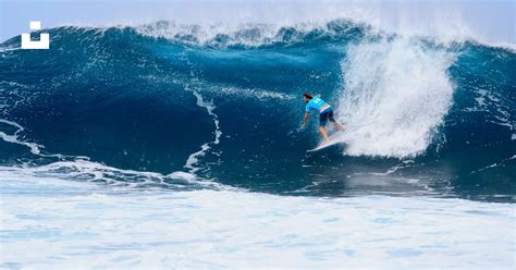 Surfer Surfing On Tidal Wave Photo Free Surfing Image On Unsplash