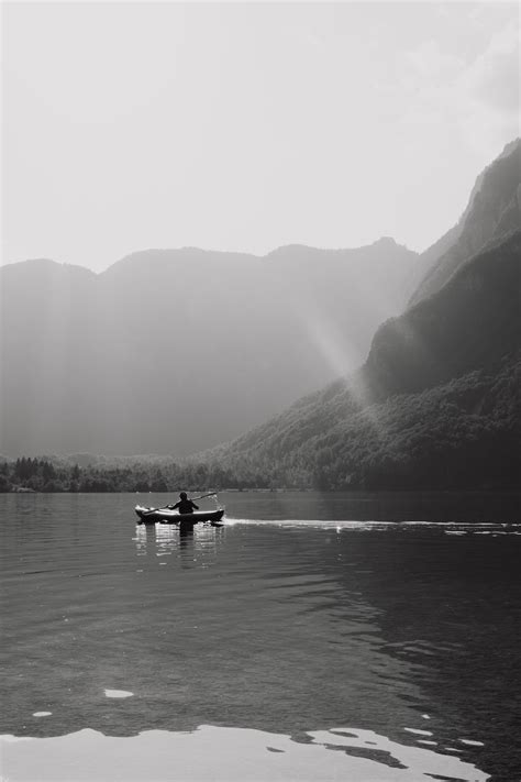 A Boat On A Body Of Water In A Mountain Valley · Free Stock Photo