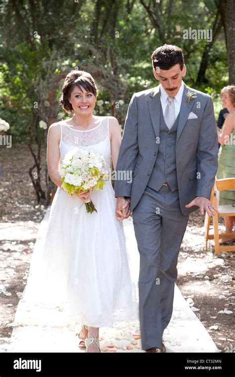 Bride And Groom Walking Down The Aisle Stock Photo Alamy