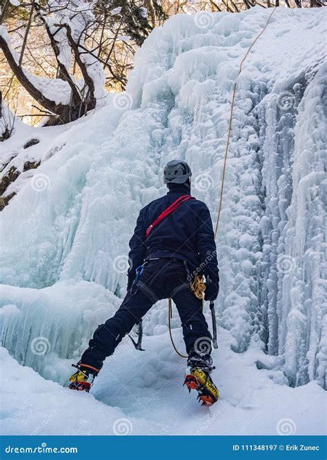 The Man Climbing Up The Frozen Waterfall Editorial Photography Image