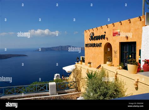 Restaurant on the cliff-top town of Fira on the Island of Santorini ...