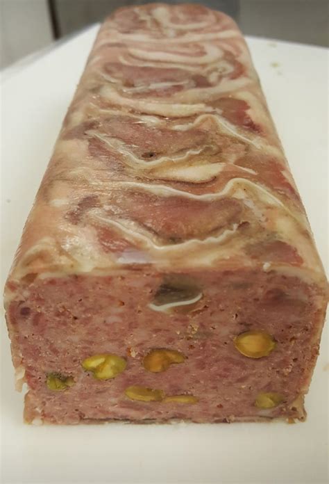 Pork Chicken Liver And Pistachio Terrine Wrapped In Porchetta Di Testa