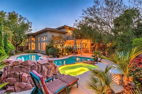 A House With A Swimming Pool Surrounded By Trees