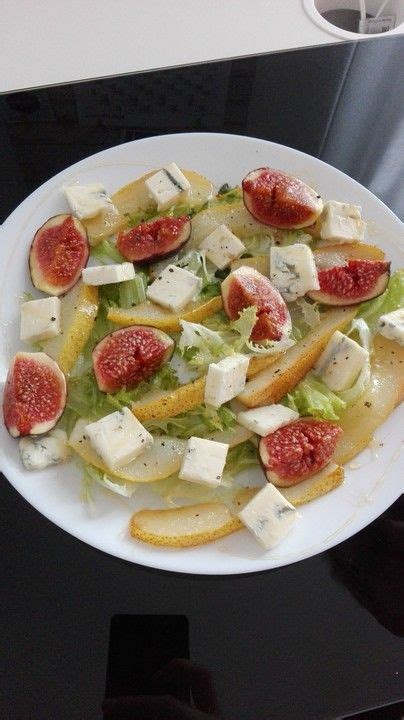 A White Plate Topped With Lots Of Food On Top Of A Table