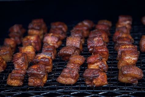 The Meat Is Being Cooked On The Grill