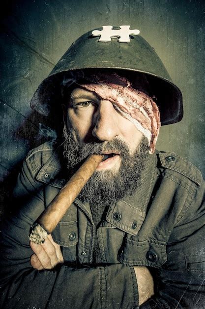 Premium Photo Portrait Of Bearded Mature Man Wearing Helmet Smoking Cigar