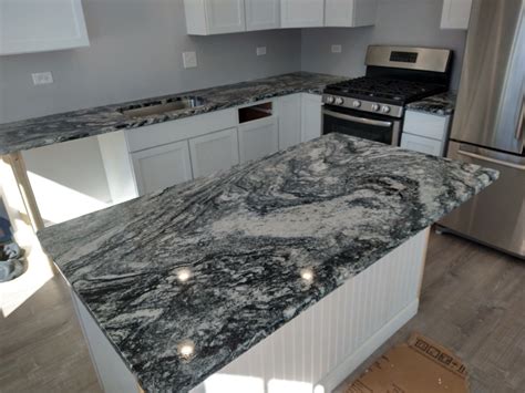 Volga Blue Granite White Cabinets