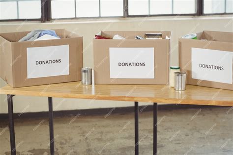 Premium Photo Cardboard Donation Boxes On Table