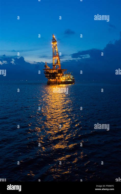 Crane Barge And Oil Rig In The Sunset Stock Photo Alamy