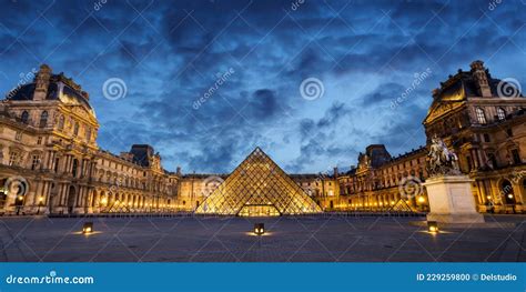 Panorama Of The Museum And Pyramid Of Le Louvre Illuminated At Night In