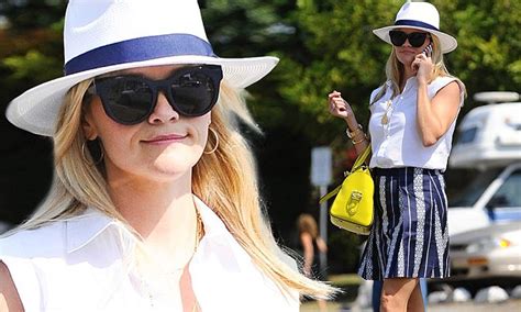 Reese Witherspoon Is Pretty In Pleats As She Showcases Her Own Clothing