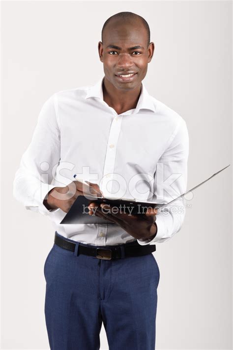 Black Man Wearing Casual Clothes In Black Background Stock Photo