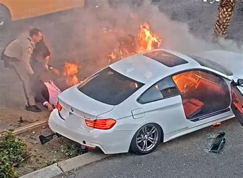 Police Officer And Good Samaritan Rescue Unconscious Driver