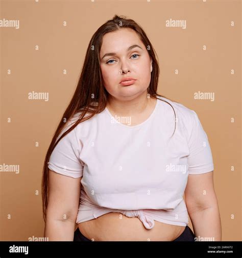 Lazy Overweight Woman On Beige Background Unhealthy Lifestyle Stock