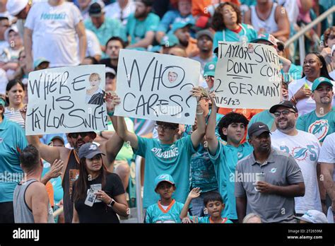 Miami. FL USA; Miami Dolphins fans waves signs about the upcoming game ...