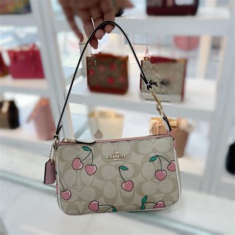 Coach Cf Nolita In Signature Canvas With Heart Cherry Print