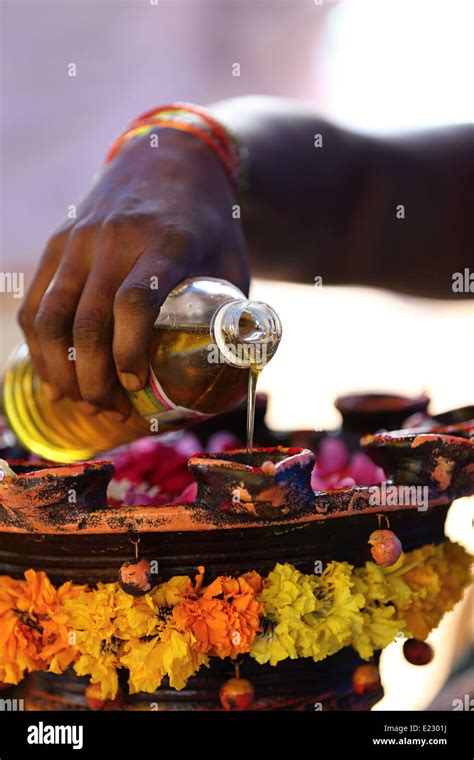 Indian Woman Pouring Oil For A Hindu Ceremony India Stock Photo Alamy