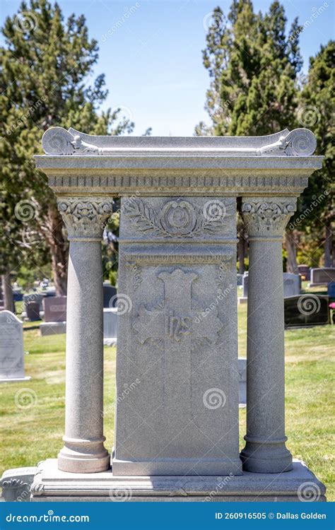 Religious Stone Headstone with Columns and a Cross at a Cemetery Stock ...