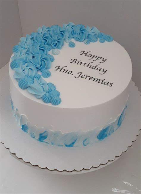 Blue and White Birthday Cake with Floral Decorations