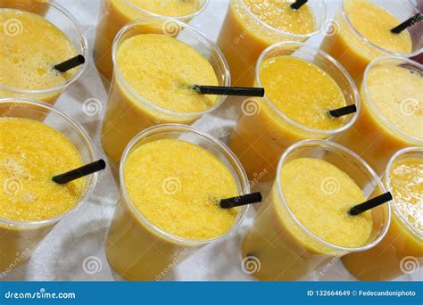 Many Plastic Cups With Healthy Orange Juice Stock Image Image Of