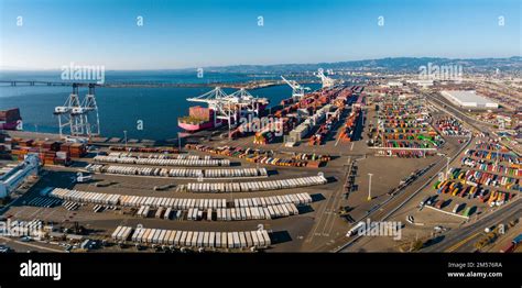 The Oakland Outer Harbor Aerial View Loaded Trucks Moving By Container