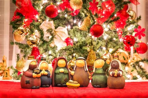 Premium Photo | Christmas nativity scene in front of christmas tree