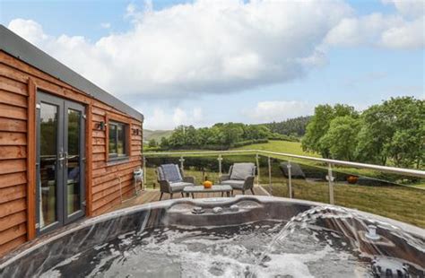 Lodges Log Cabins With Hot Tubs In North Wales Last Minute Cottages