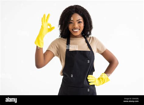 Cheerful African Housekeeper Female Showing Ok Sign As Great Cleaning