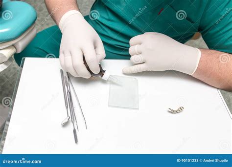 A Dentist Prepares An Implant In The Clinic Stock Image Image Of Care