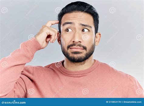 Thinking Question And Doubt With A Man In Studio On A Gray Background