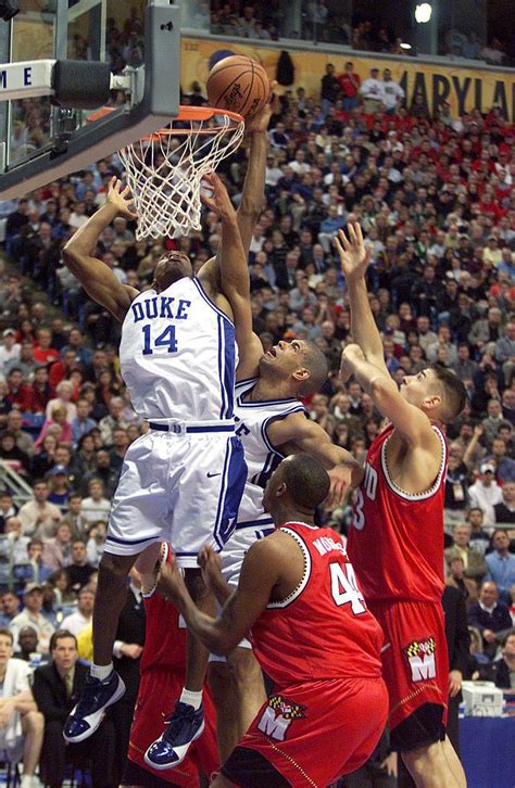 Nate James and Shane Battier of Duke fend off the Maryland defense ...