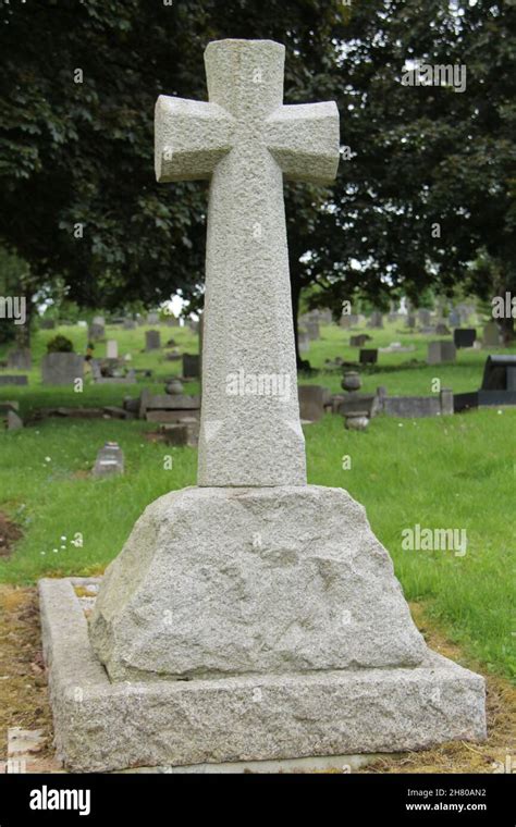 A Stone Cross On A Plinth At A Grave In A Cemetery Stock Photo Alamy