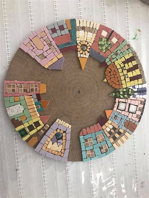 A Circular Piece Of Art Made Out Of Colorful Tiles