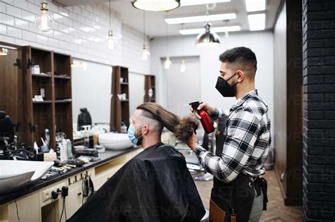 Man Client Visiting Haidresser And Hairstylist In Barber Shop