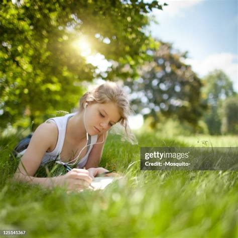 Happy Tween Girls Lying On Grass Photos And Premium High Res Pictures