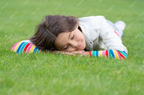 Premium Photo Teen Girl Sleeping On Green Grass Outdoors Sleep