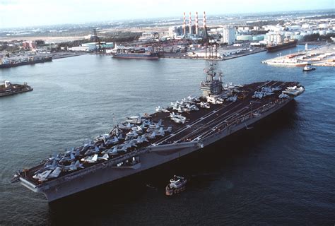 A Tug Escorts The Nuclear Powered Aircraft Carrier Uss Dwight D Eisenhower Cvn 69 As The